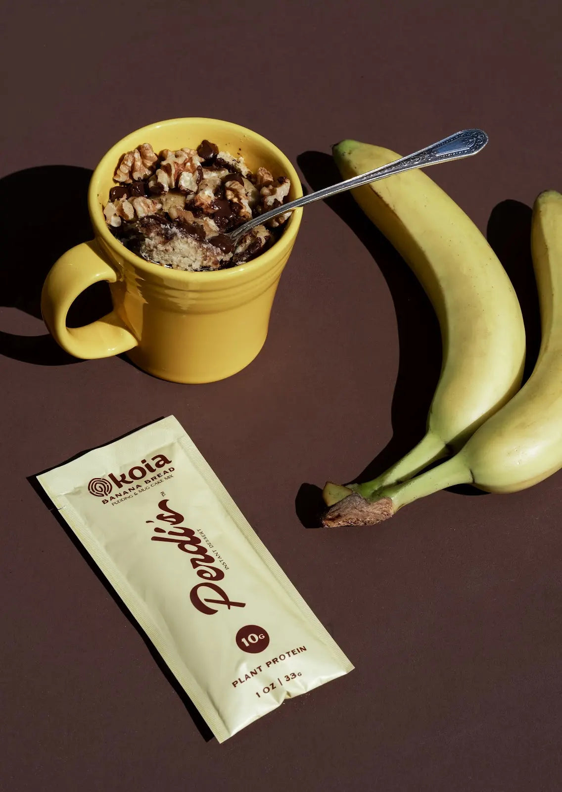 Banana Bread mug cake beside the packet and bananas