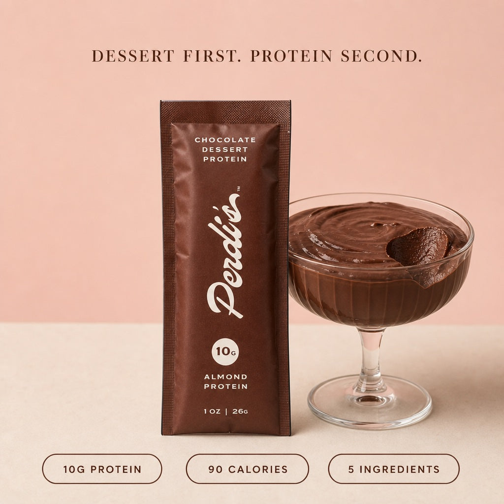 Perdi's chocolate packet beside a coupe of thick chocolate pudding — 10g protein, 90 calories, 5 ingredients